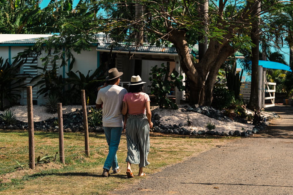 Man and Woman walking in a tropical farm